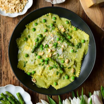 Four Cheese Ravioli served with a homemade pea and asparagus soup/sauce.