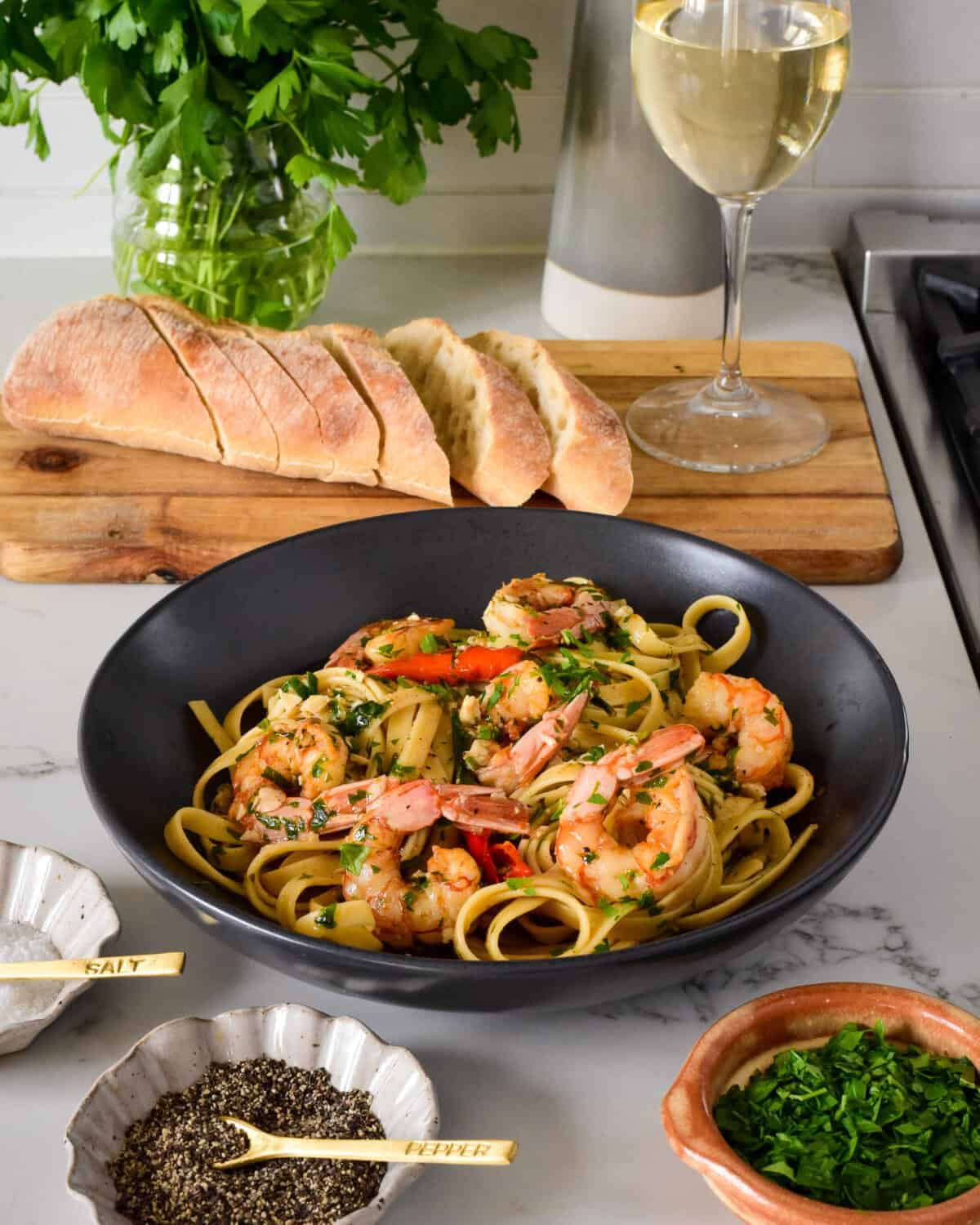 A bowl of spicy garlic shrimp pasta.