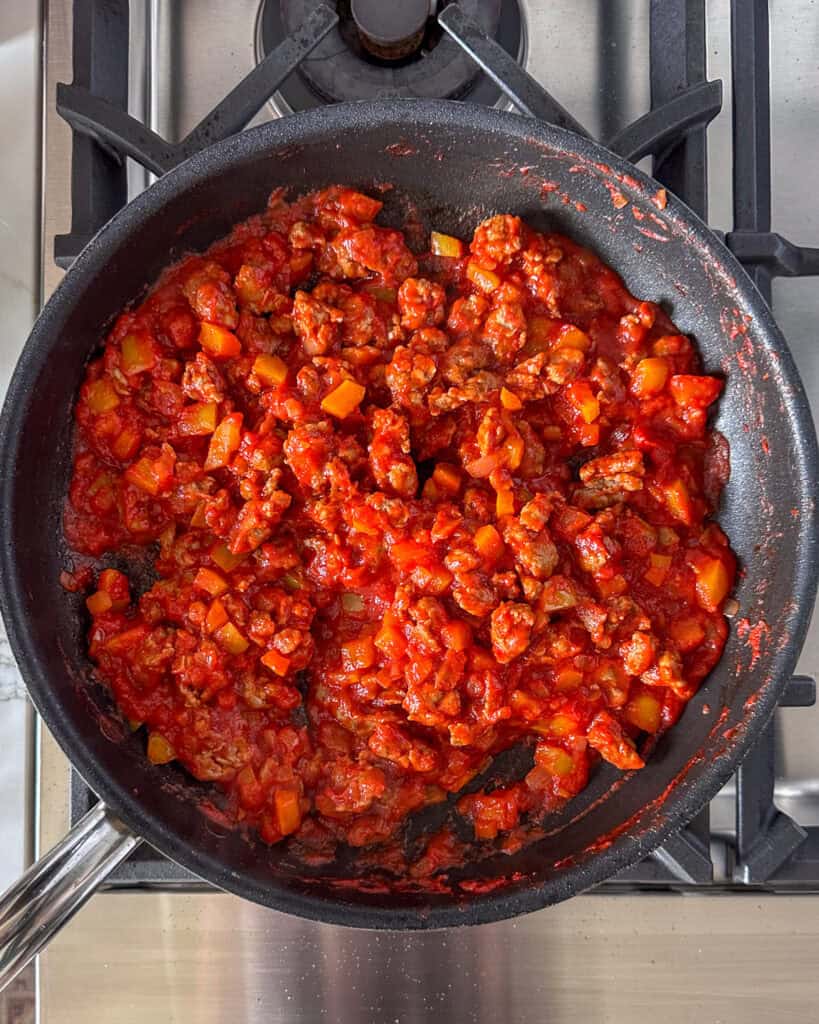 Add the strained meat into the sauce and simmer.