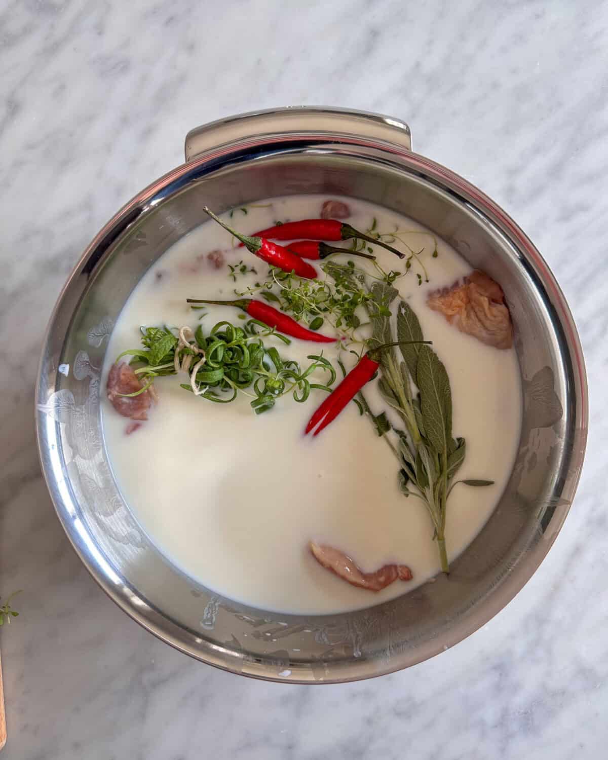 In a large bowl, combine the chicken thighs and marinade ingredients. Mix well to combine.