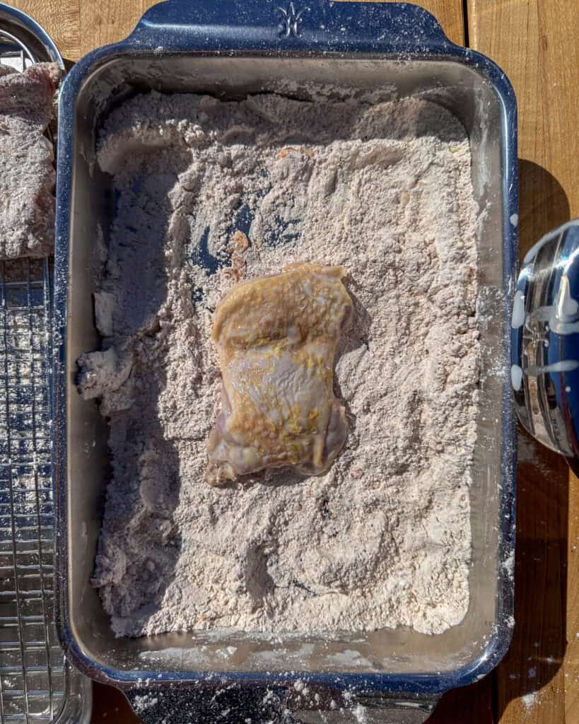 Place the thigh into the breading mixture