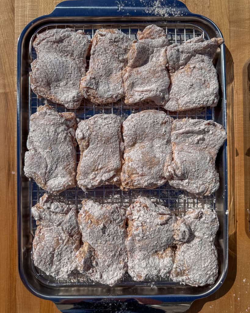Transfer chicken to a rack over a sheet pan.