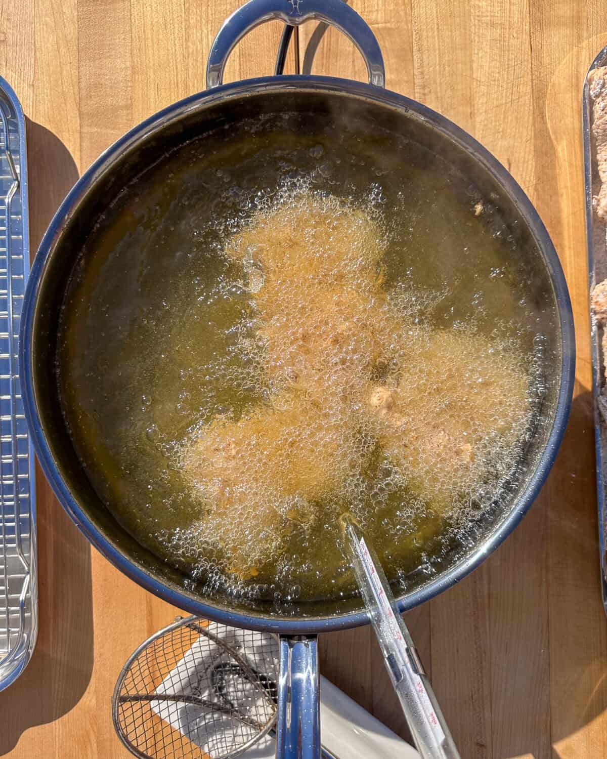 Gently place chicken into the oil - skin side down if you left the skin on.