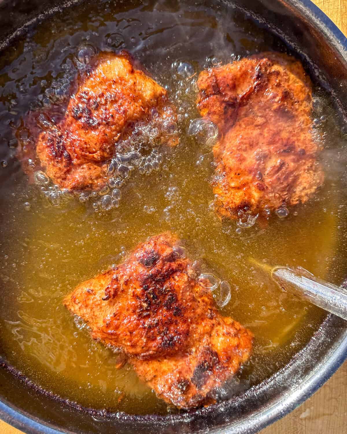 Cook for 5 minutes, then carefully flip, and cook for 3 minutes more or until deep golden brown and the internal temperature at thickest part is at least 165°F.