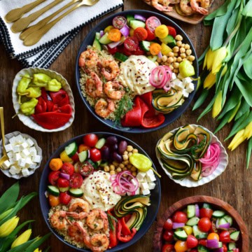 Sheet Pan Lemon Garlic Shrimp Bowls served with extra toppings on the side.
