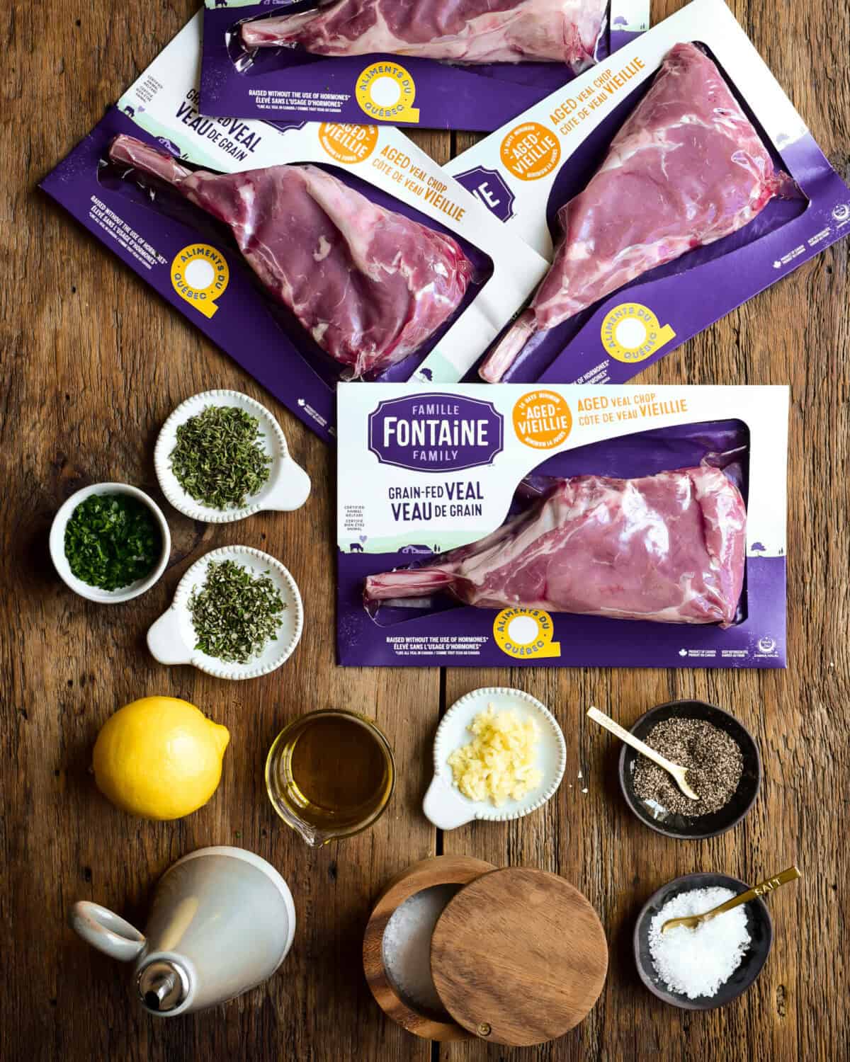 Ingredients laid out for a Tuscan Style veal chops recipe.
