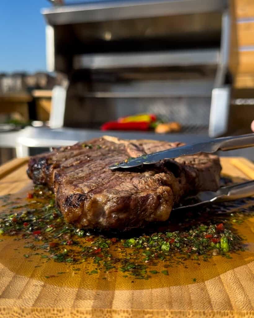 Place the steak on the cutting board steak sauce to rest.