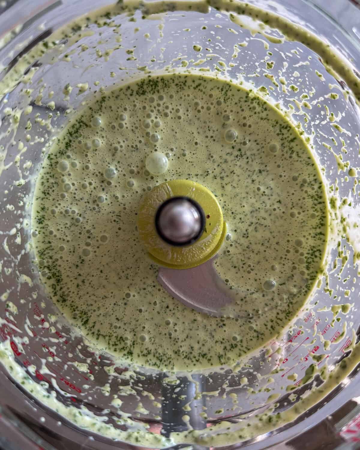 Buttermilk-herb dressing in a food processor.