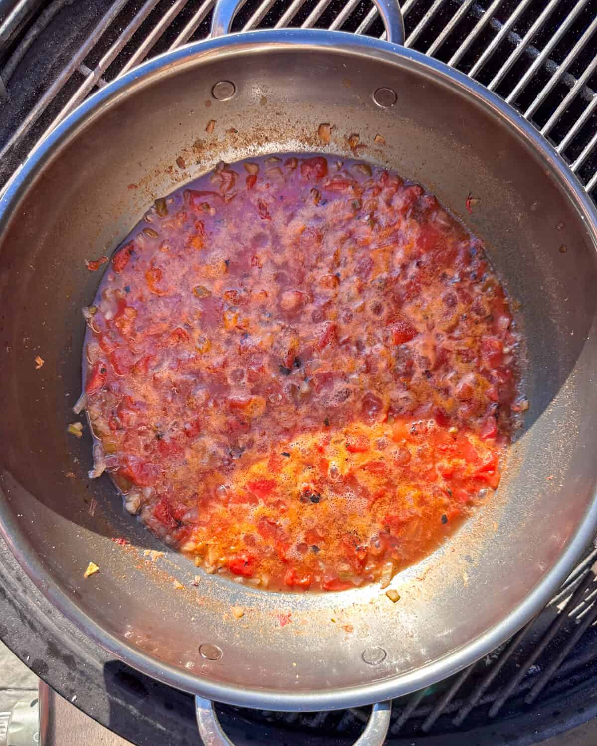 Add chicken stock and tomatoes and bring to a low boil.