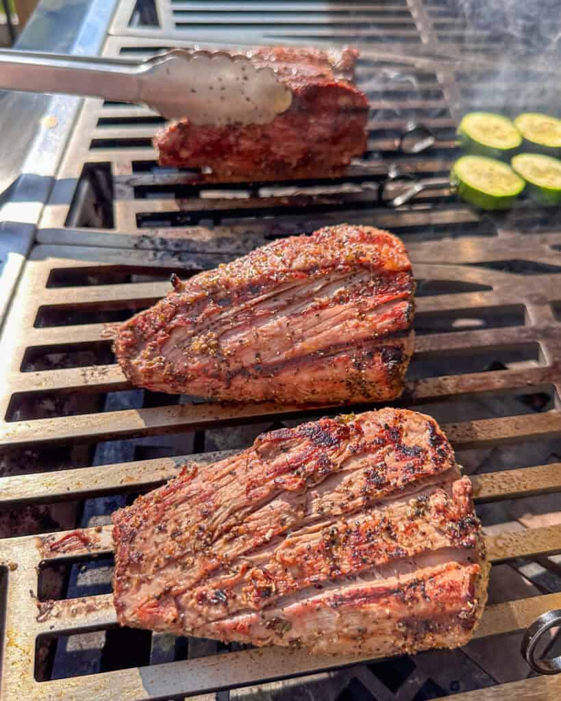 Three pieces of veal on the grill.