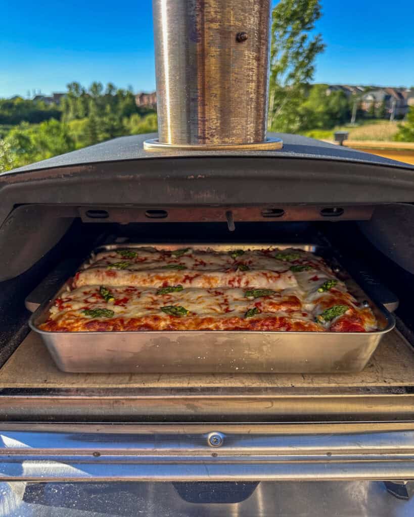 A lasagna baking in the ooni oven.