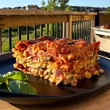 A side view of a piece of lasagna showing the layers.