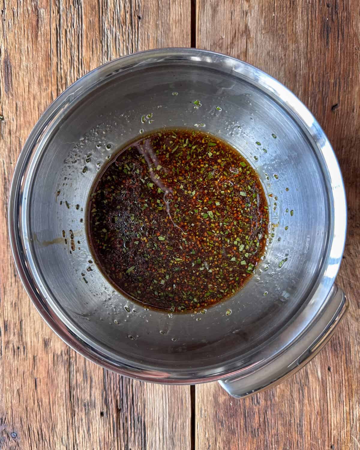 Honey mustard pork tenderloin marinade mixed in bowl.