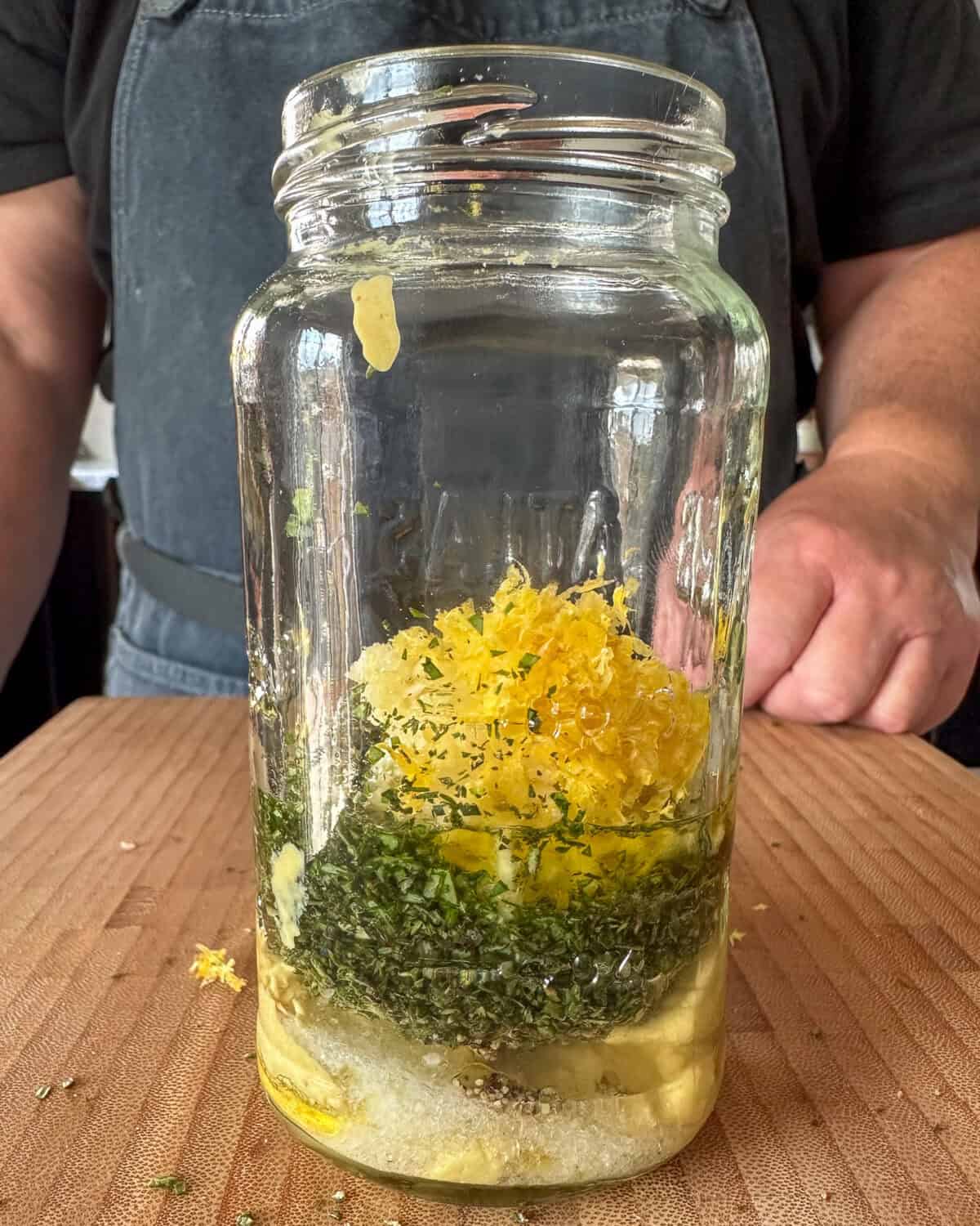 Ingredients for a grilled veal chop marinade in a jar.