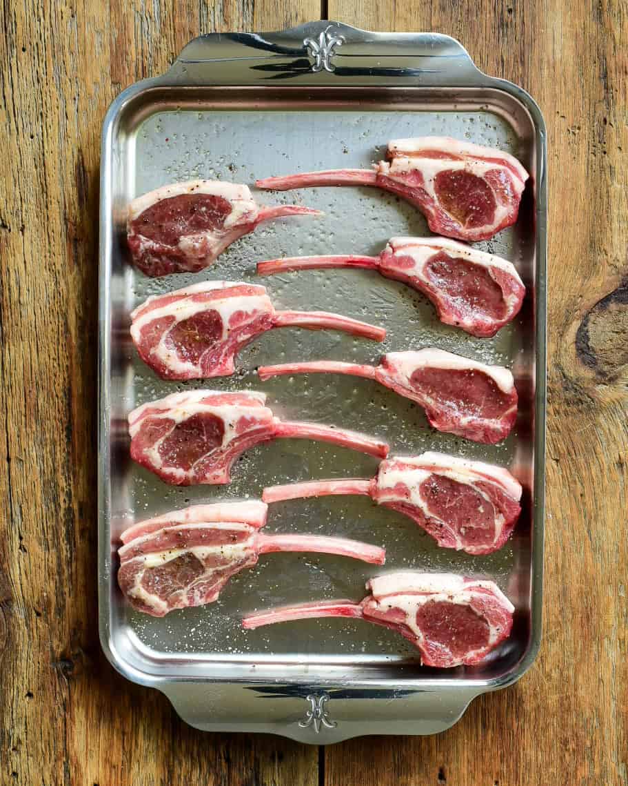 Lamb chops seasoned with salt and pepper.
