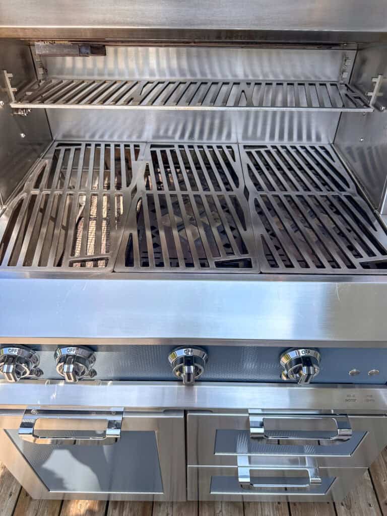 A shiny gas grill after being cleaned.