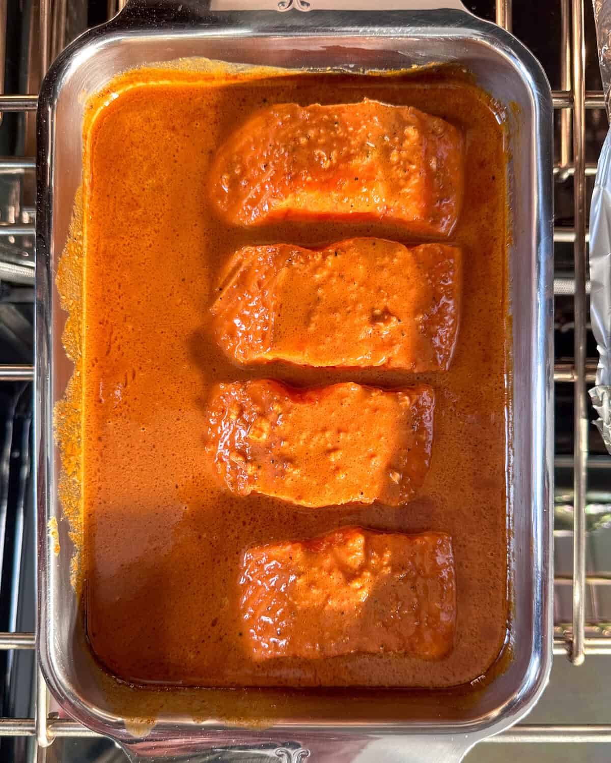 Salmon baked in a curry sauce.