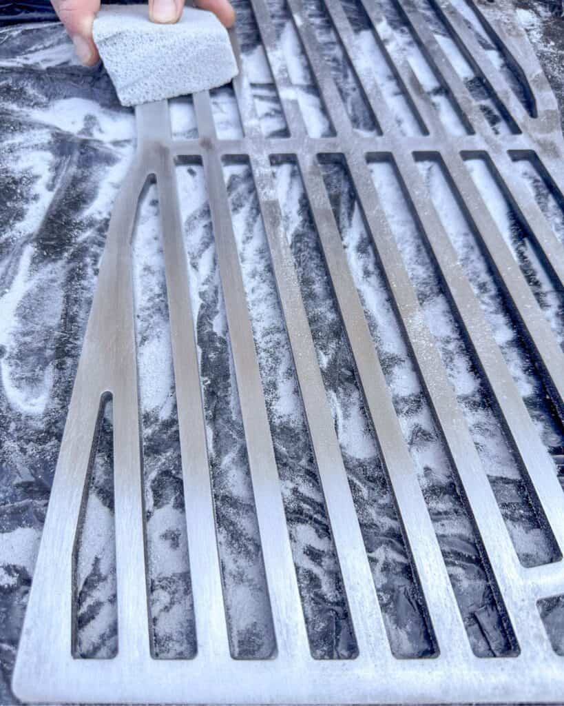 How to clean your gas grill grates with a scrubbing grill brick.