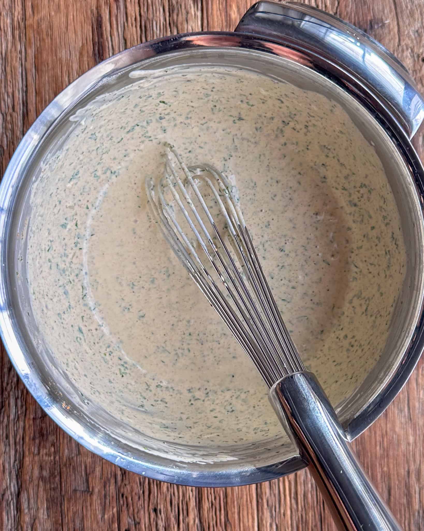 In a small bowl, whisk together mayonnaise, Greek yogurt, lime juice, Dijon mustard, cilantro, garlic, and chili powder.
