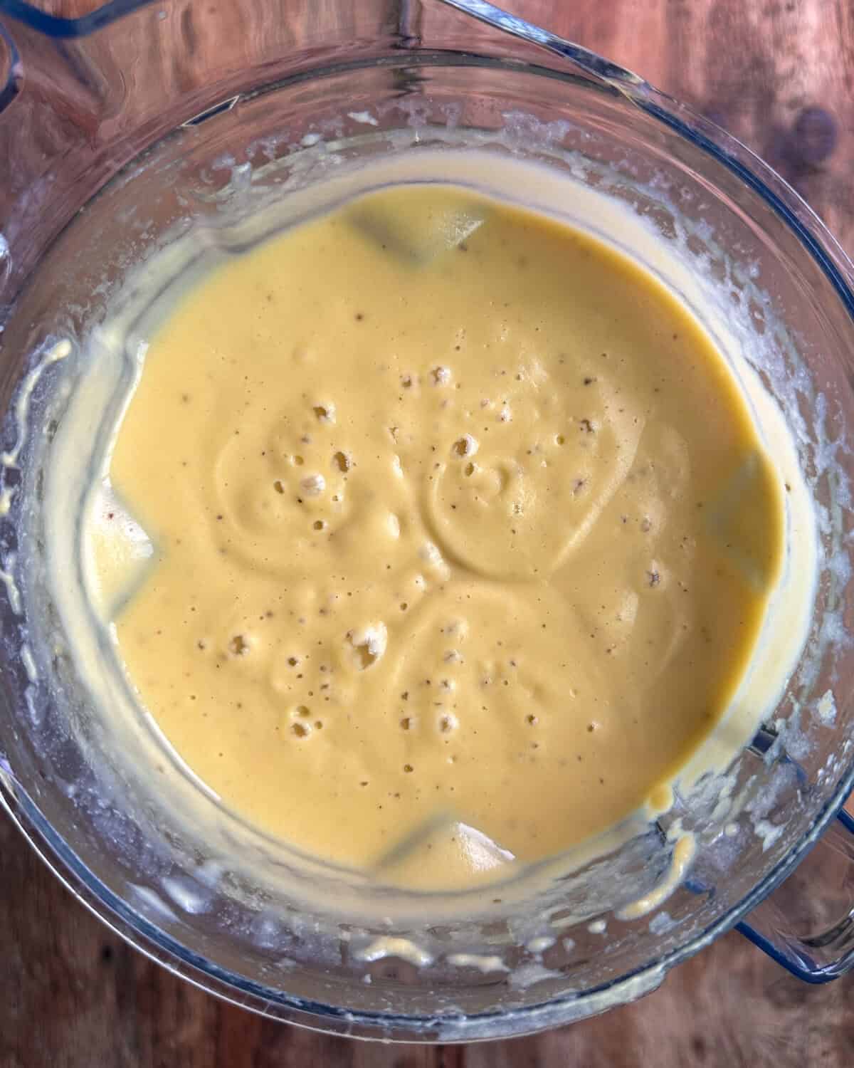 Pour the hot contents of the pot into the blender with the cauliflower mixture and blend until smooth.