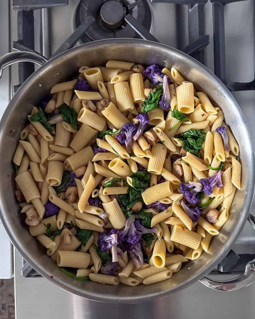 Add the pasta to the pan and toss to coat.