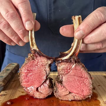 A medium-rare grilled venison rack cut open.