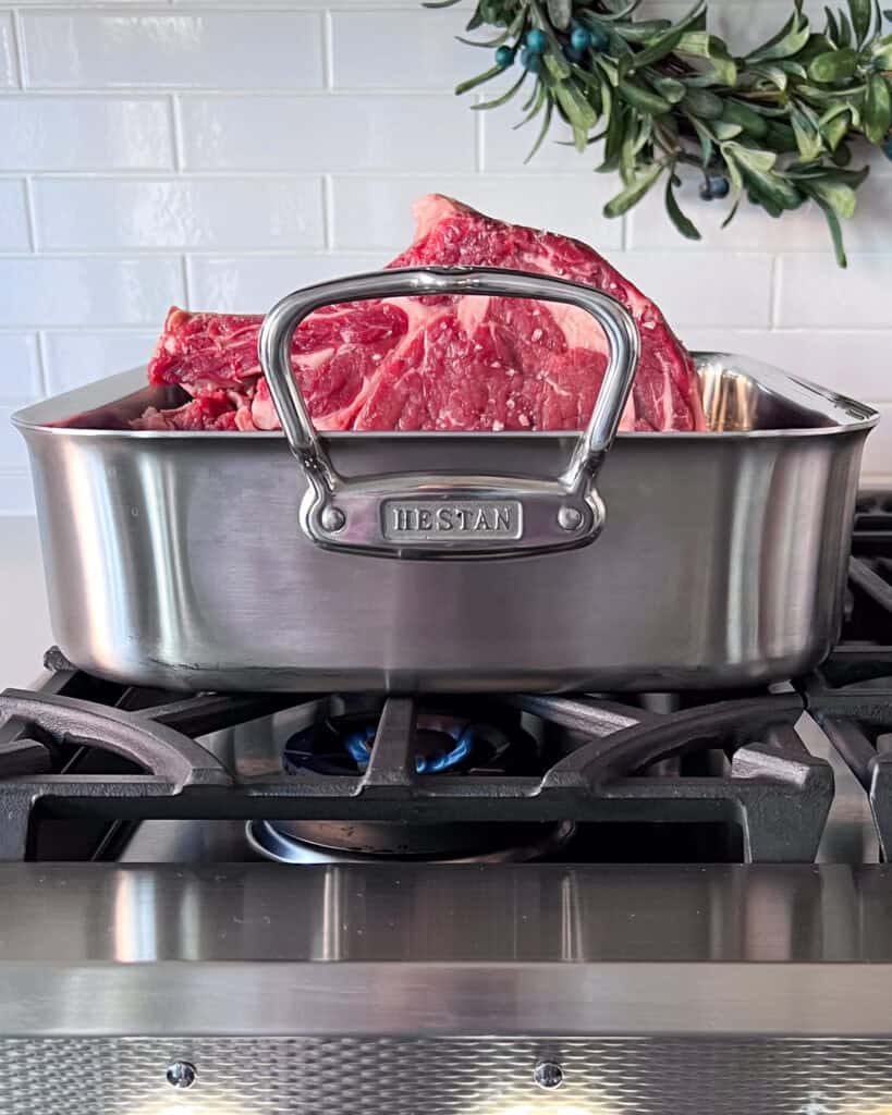 Place the roast fat side down in the roaster and sear for about 5-7 minutes until the fat is golden brown.