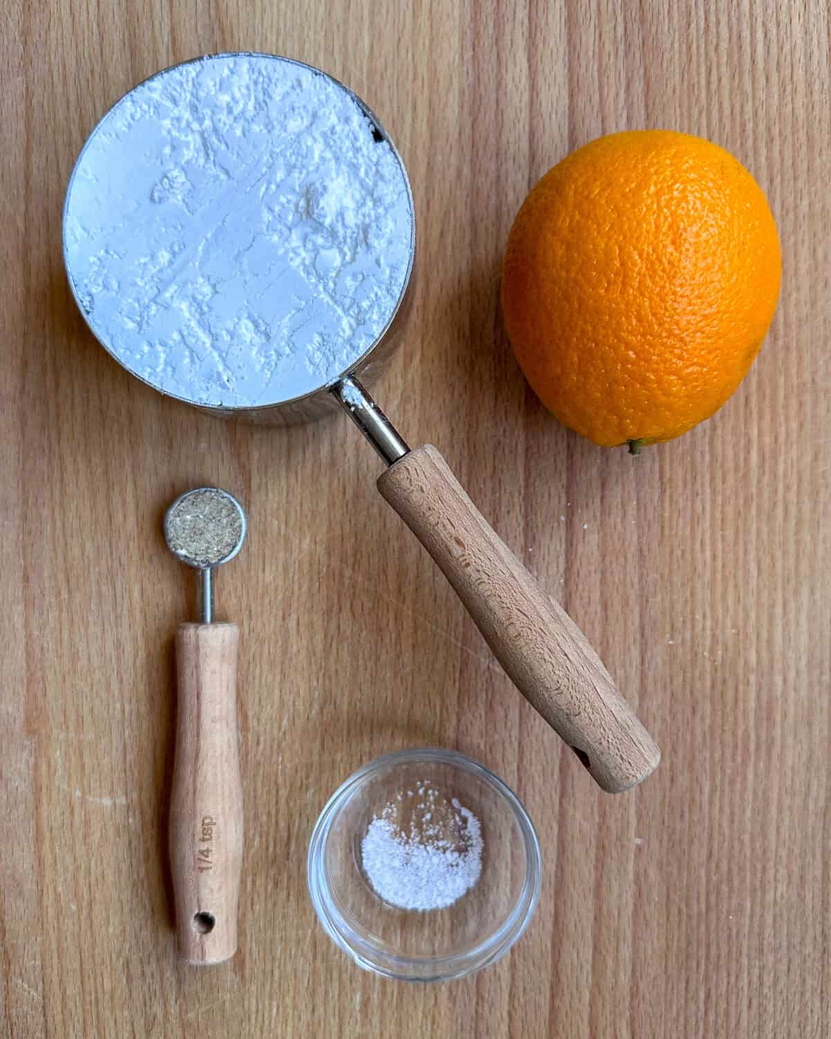 Ingredients for a Orange Cardamom Glaze recipe.