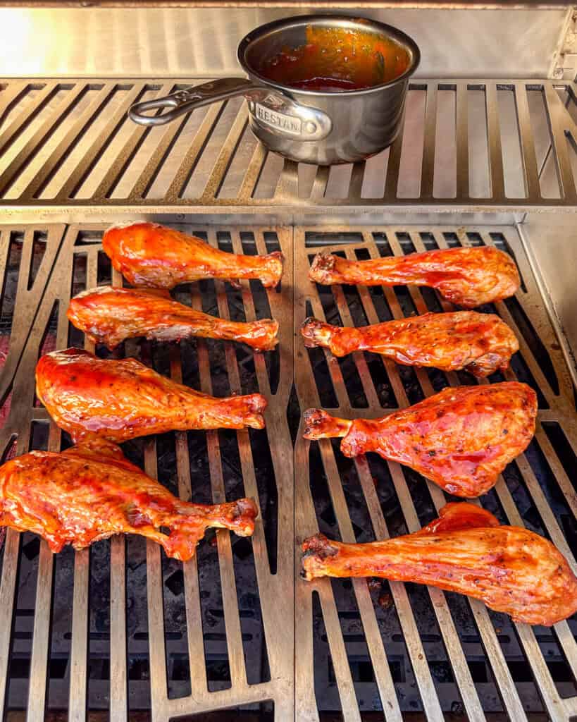 Grill the butterfly turkey legs allowing the sauce to caramelize.