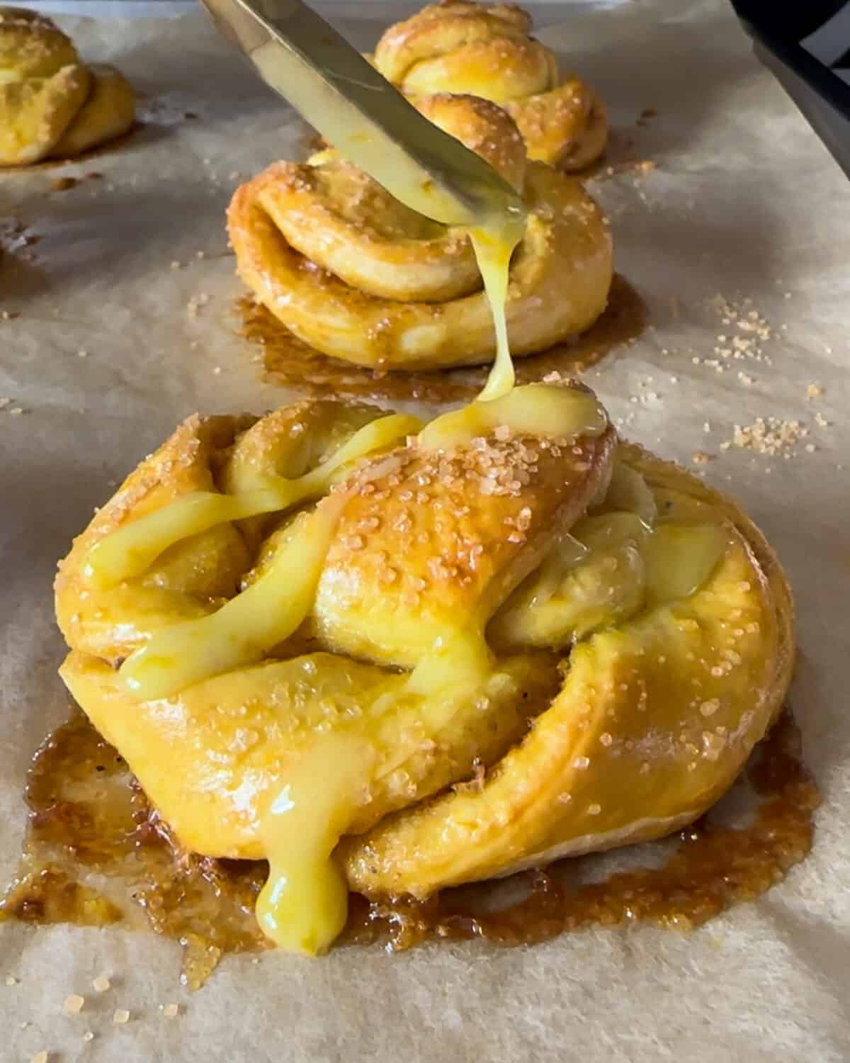 Drizzle the cooled buns with glaze.