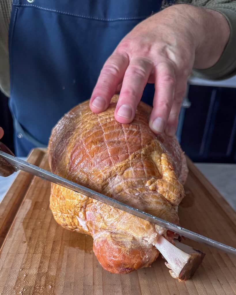 Lightly carve a crosshatch pattern across the top of the ham.