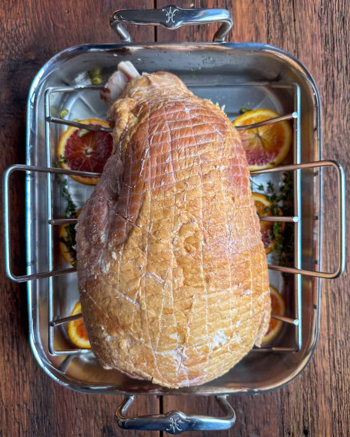 Place the ham on a rack in a roasting pan.