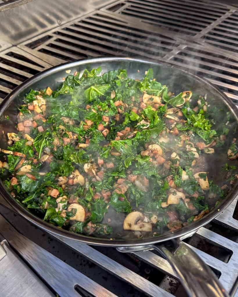Add the kale and spinach to the mushroom mixture.