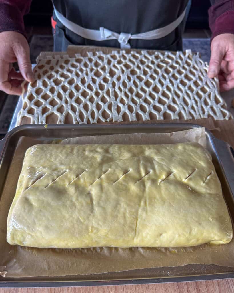 Roll out a small portion of puff pastry and use a lattice cutter to create a crisscross pattern. Carefully stretch the lattice over the top of the salmon