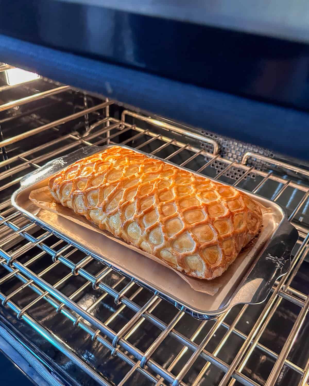 Bake the salmon puff pastry until it is golden brown.