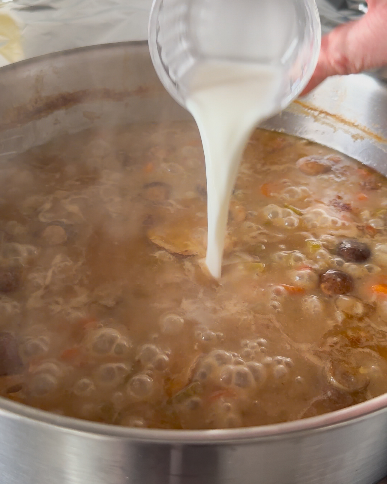 Add a cornstarch slurry to the turkey au vin sauce to thicken it.