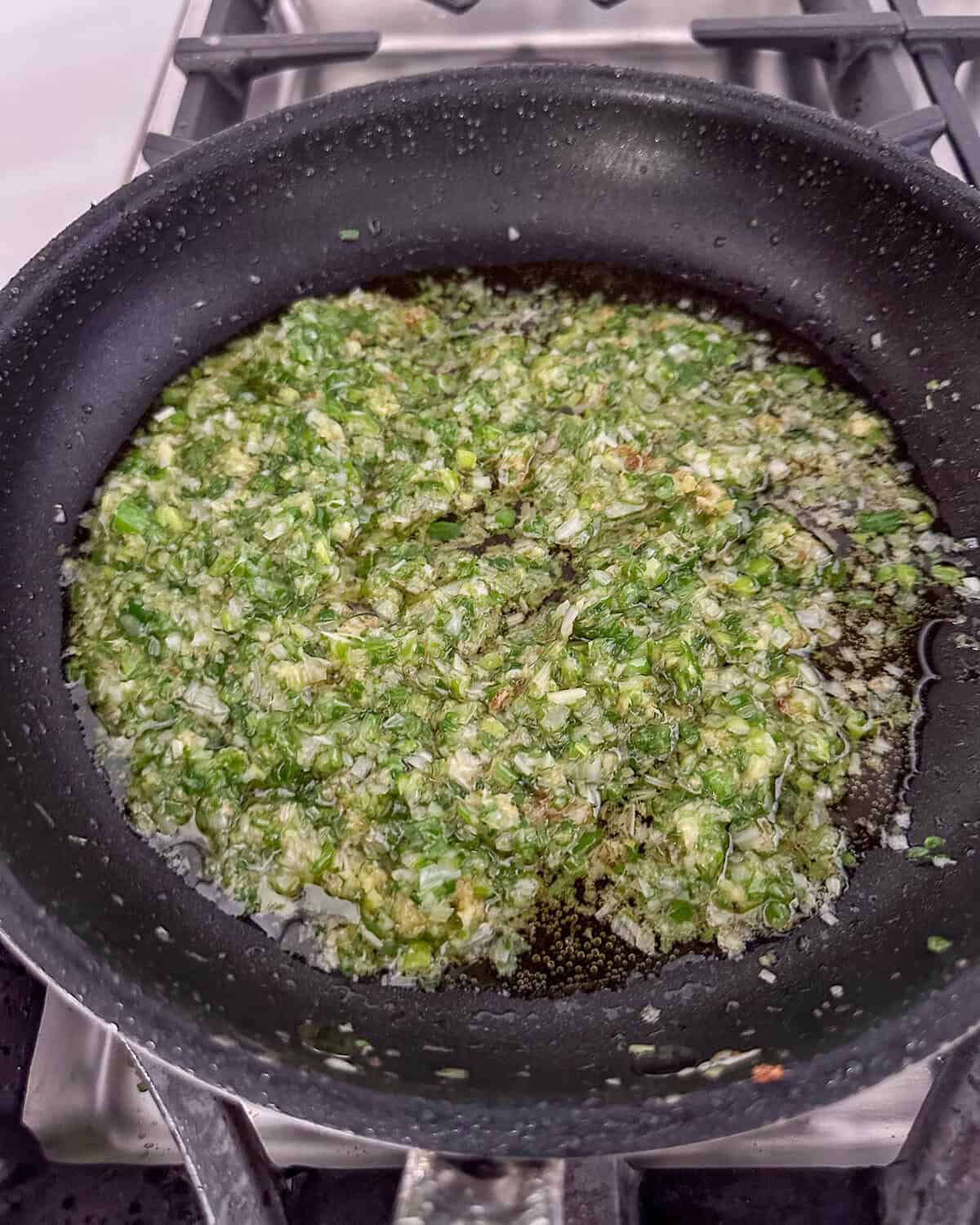 Chinese scallion ginger sauce in a skillet.