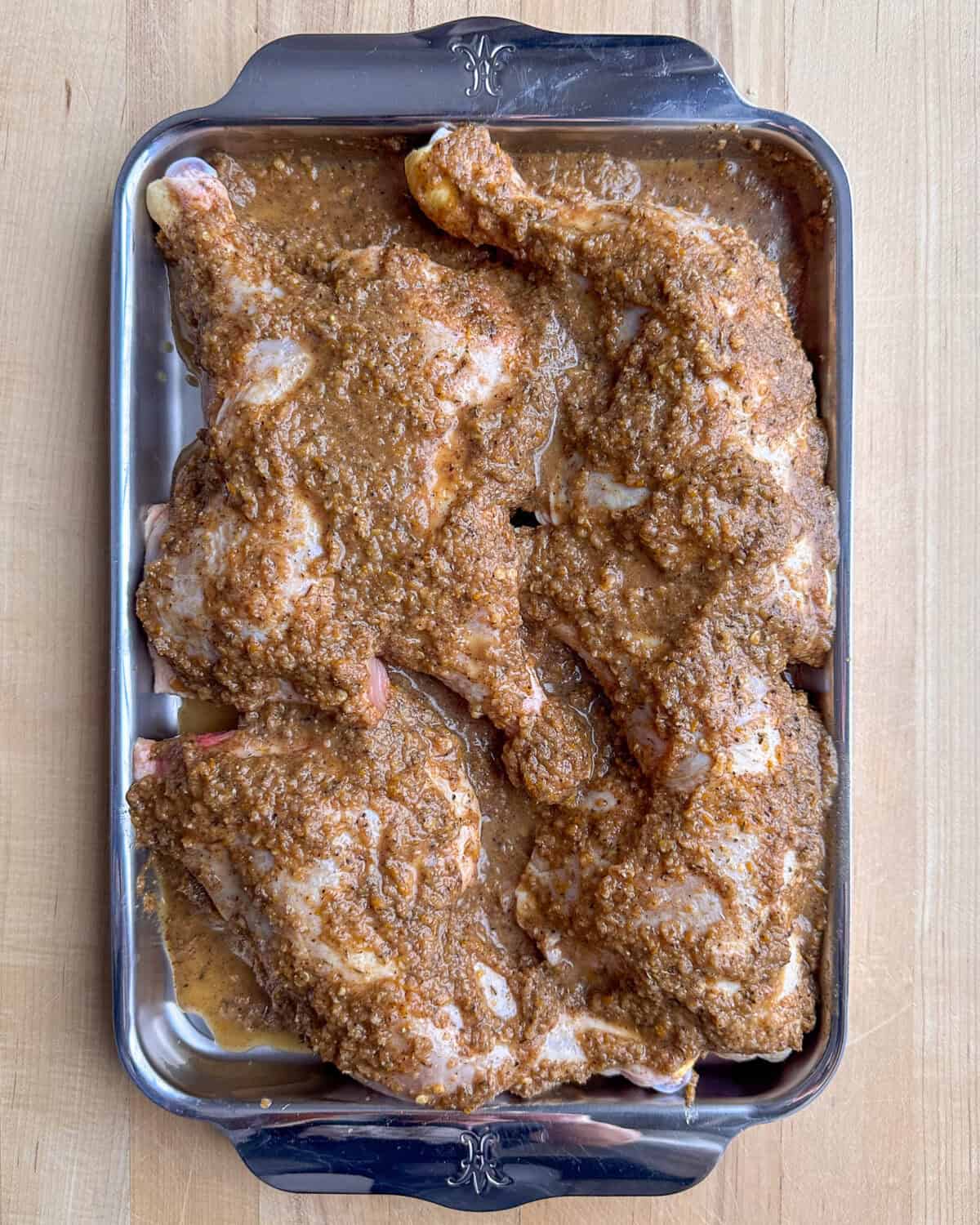 Pour the jerk marinade over the chicken, ensuring all pieces are evenly coated.