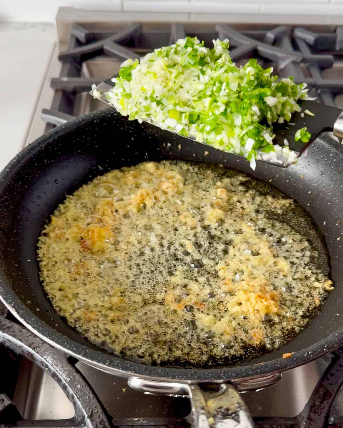 Add the scallions to the pan with the ginger.