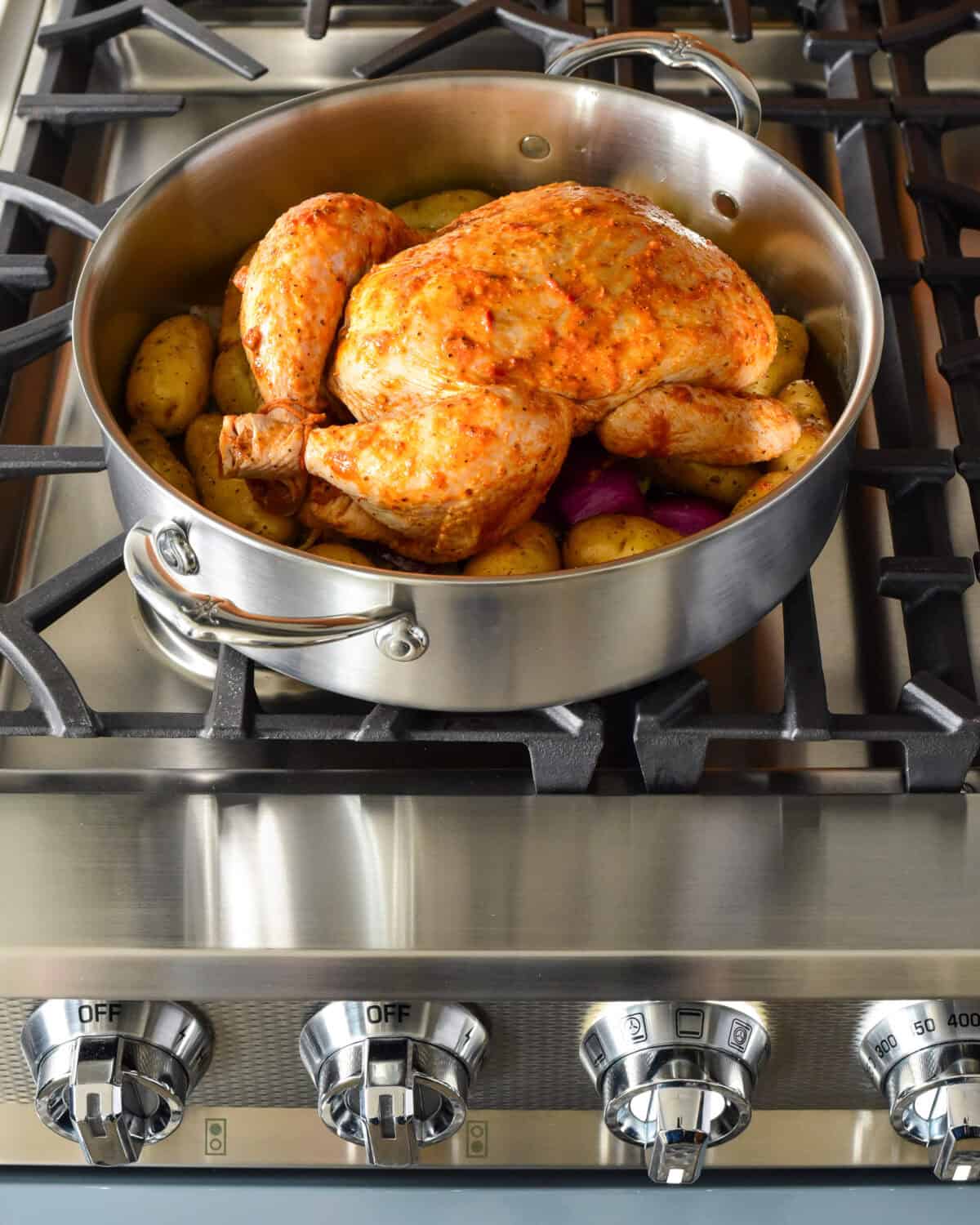 A chicken cooked in a rondeau.