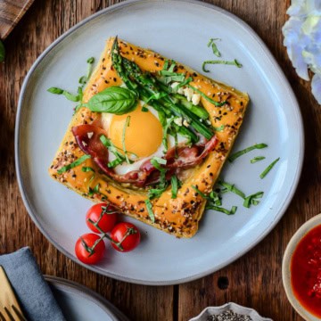 A close up of a Puff Pastry Breakfast Tarts with Pesto, Prosciutto & Feta.
