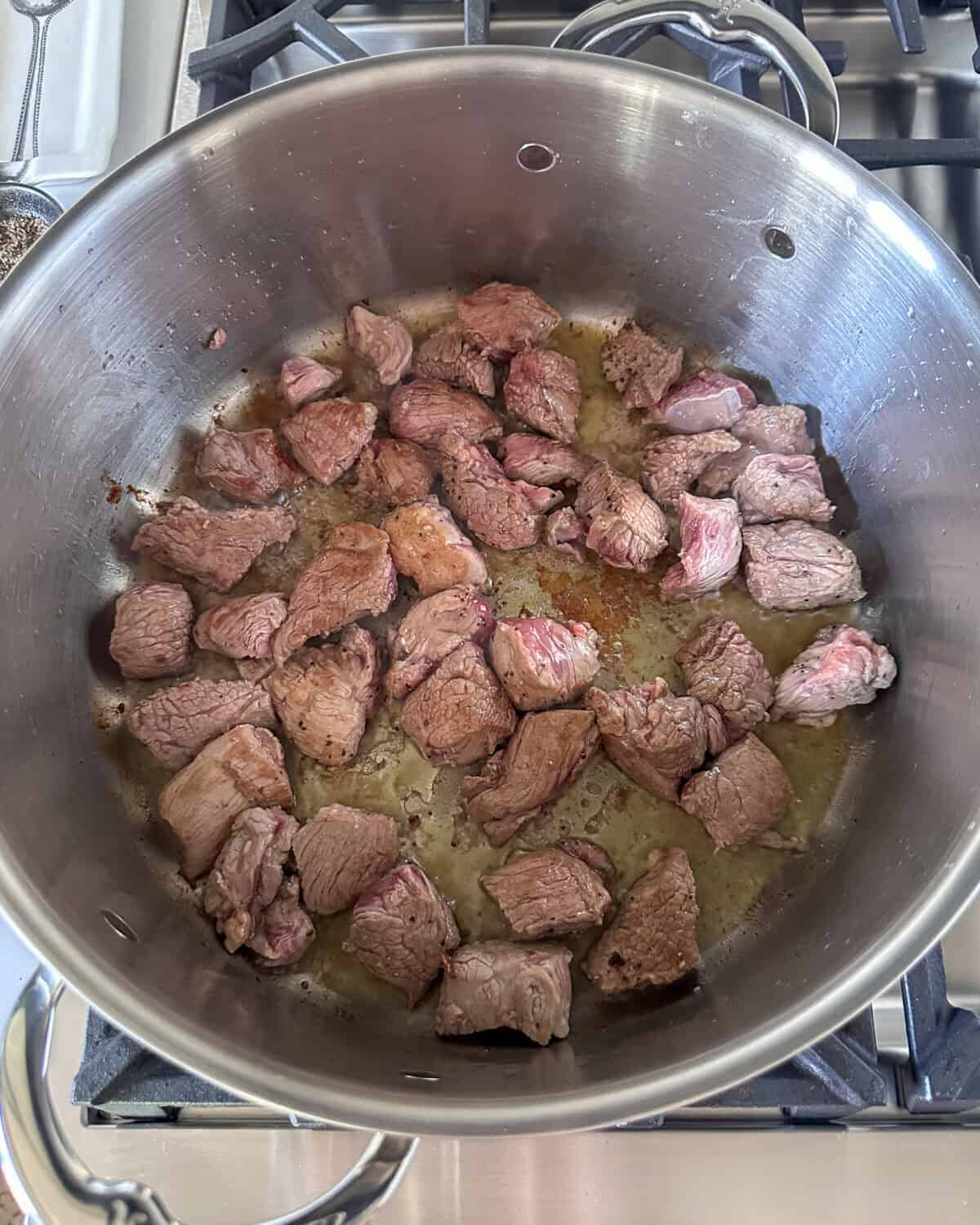 Brown the lamb pieceds in batches to avoid overcrowding.