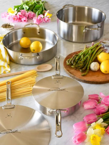 Thomas Keller cookware displayed in a spring setting.