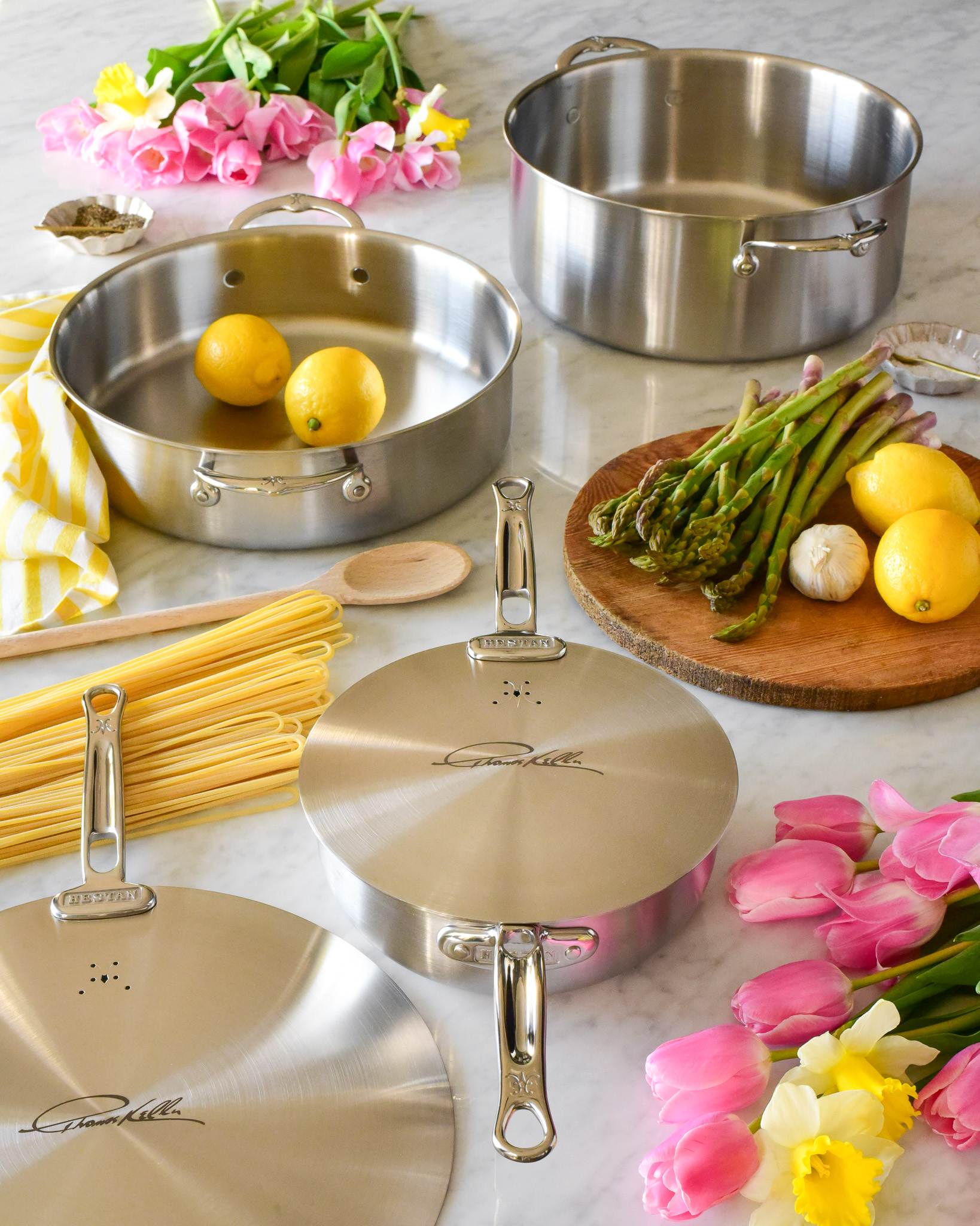 Thomas Keller cookware displayed in a spring setting.