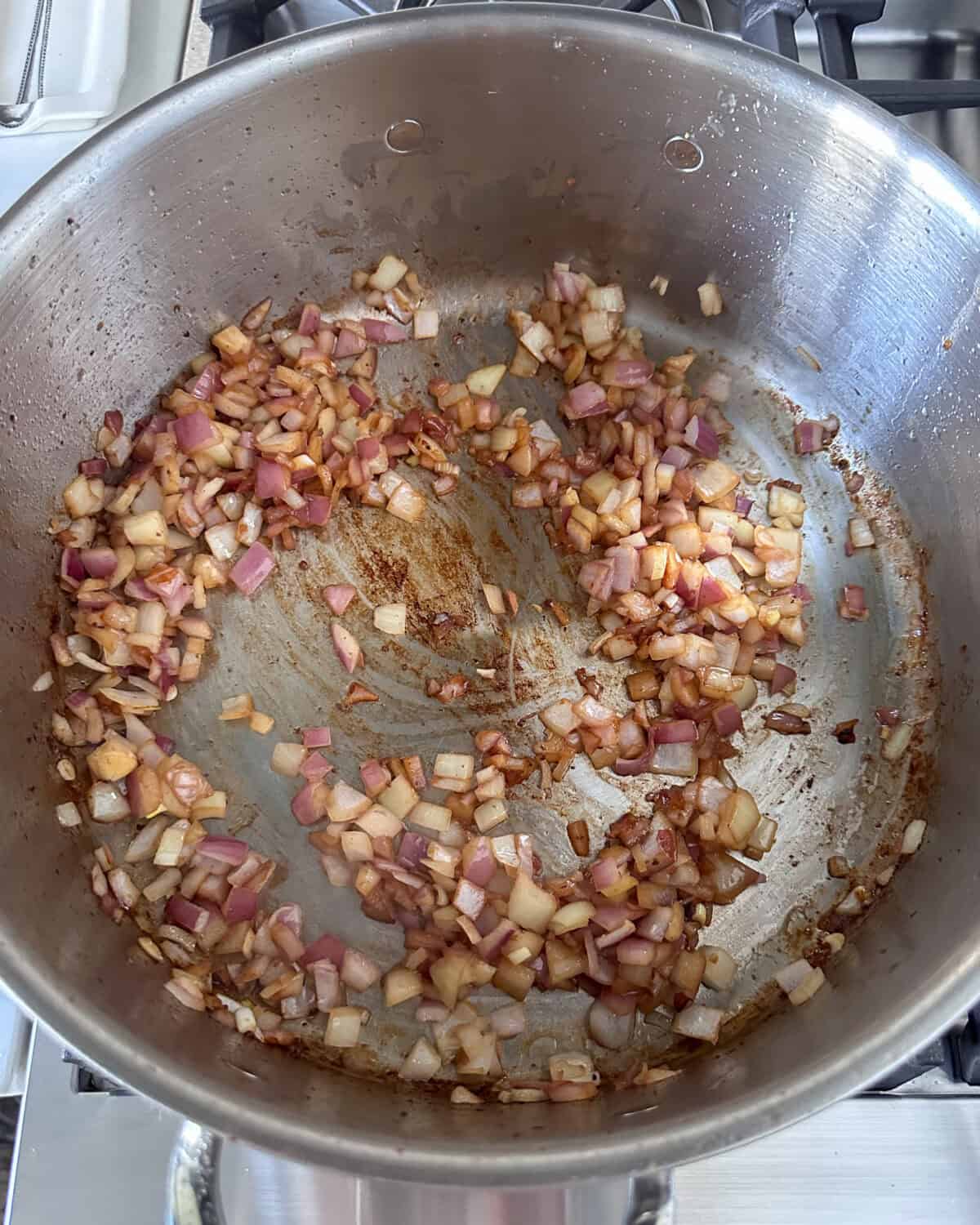 Add the onions to the pot and sauté over medium heat until soft.