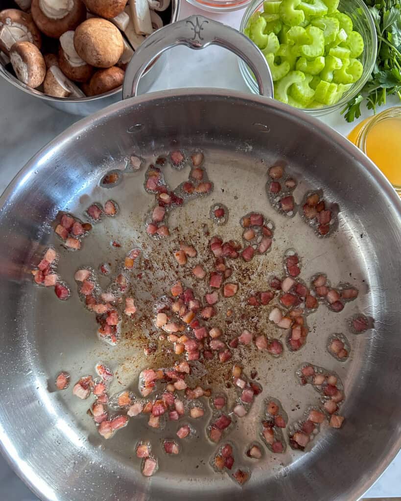 Cook the pancetta in a pan with oil.