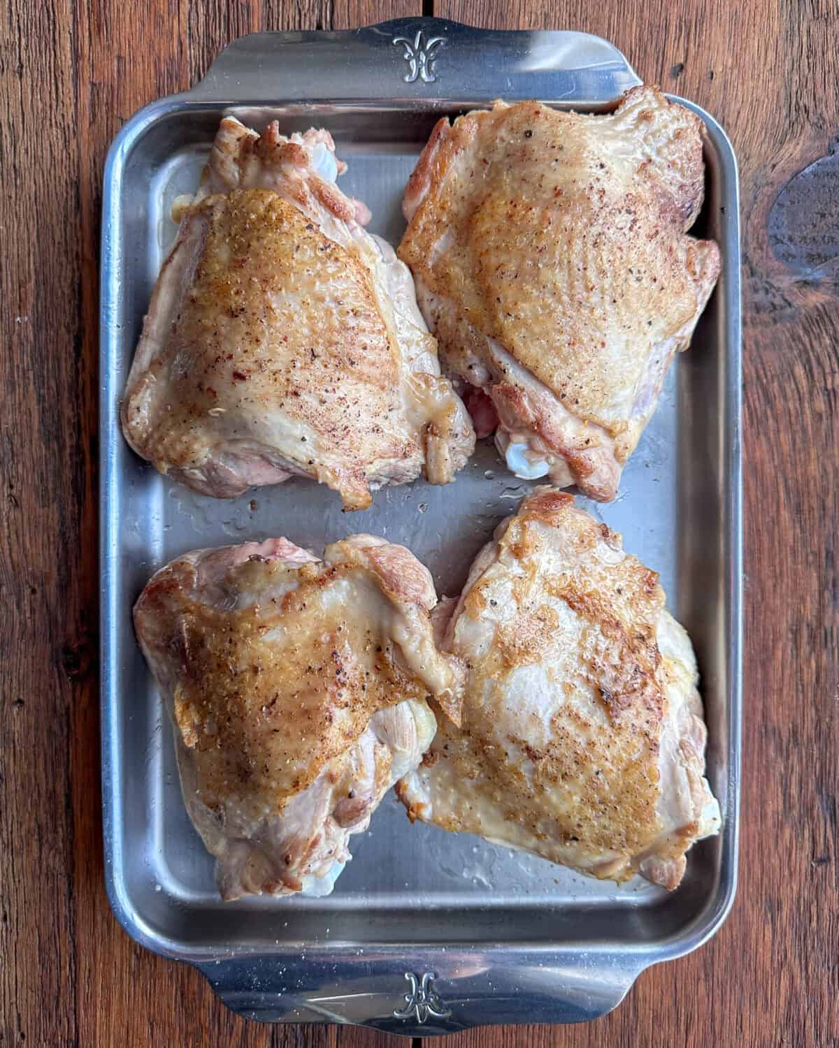 Transfer the browned thighs to a sheet pan.