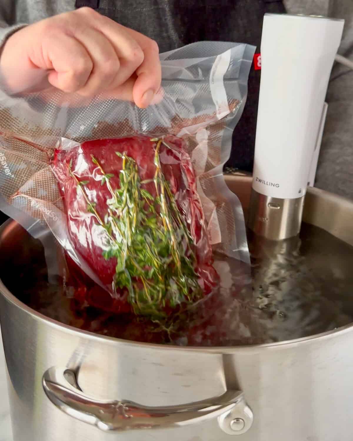 Submerge the sealed roast in the water bath and cook for 10 hours.