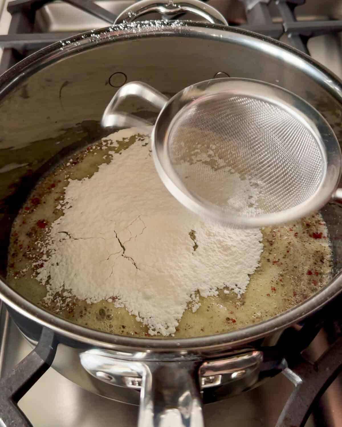 Sprinkle the flour over the pan and stir until fully incorporated.