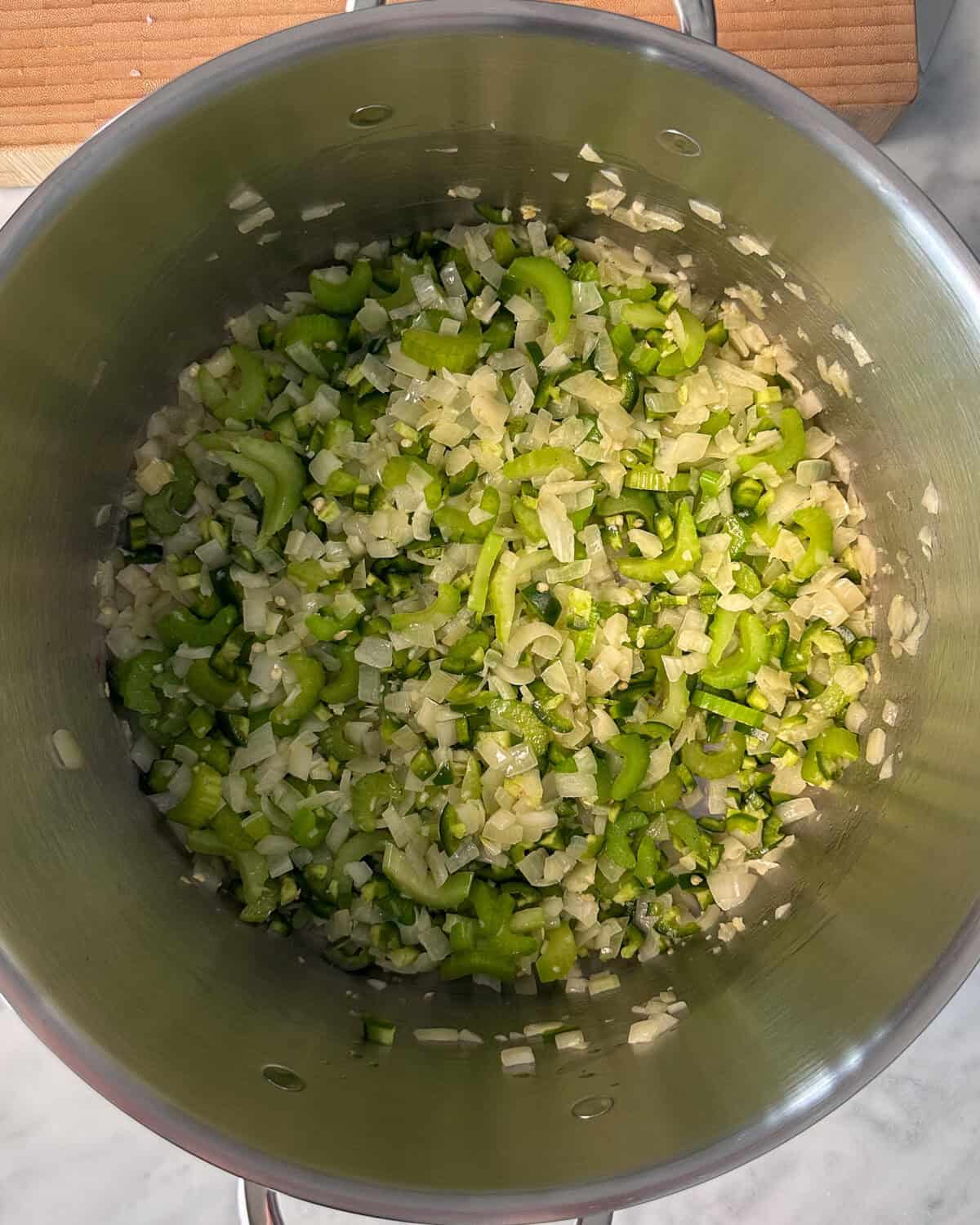 Sauté onions, celery, garlic and peppers for this vegetable chili recipe.